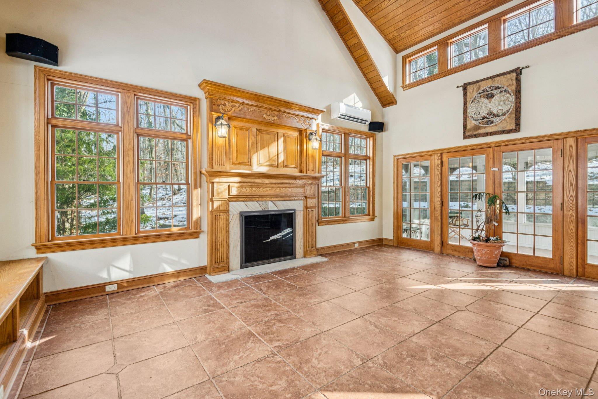 1 Spring Hollow Road St. James, NY 11780 - Photo 4 of 30 a view of an empty room with a fireplace and a window