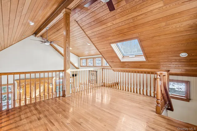 a view of a balcony with wooden floor