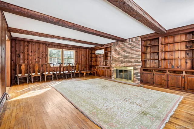a view of a livingroom with furniture and a fireplace