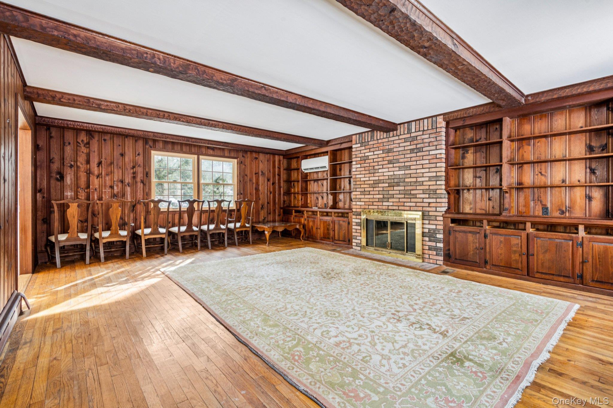 1 Spring Hollow Road St. James, NY 11780 - Photo 8 of 30 a view of a livingroom with furniture and a fireplace