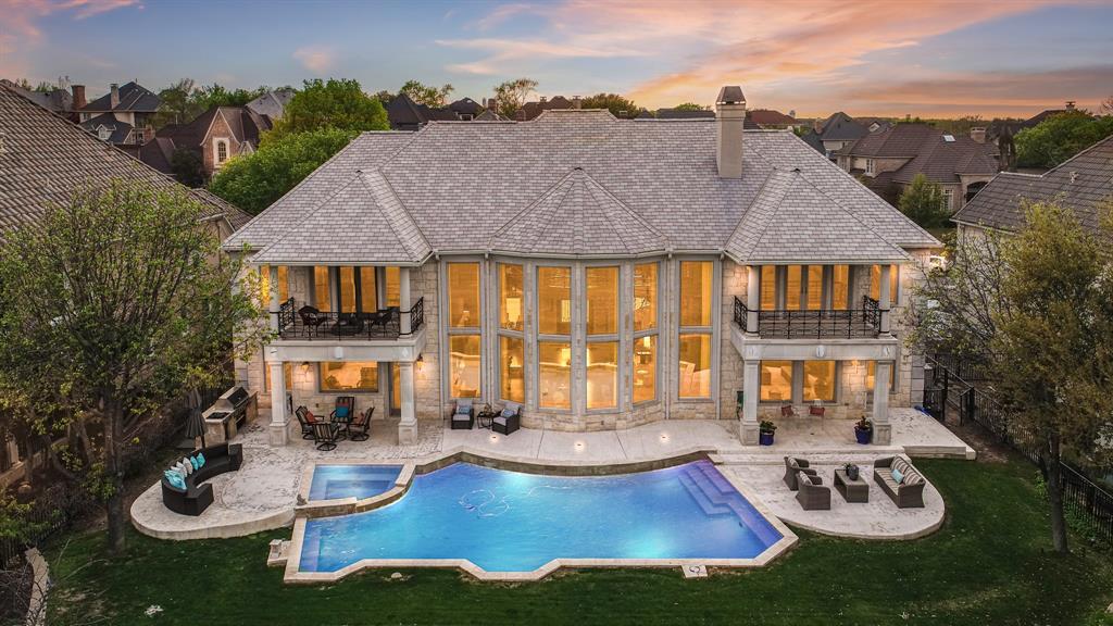 an aerial view of house with swimming pool garden and patio