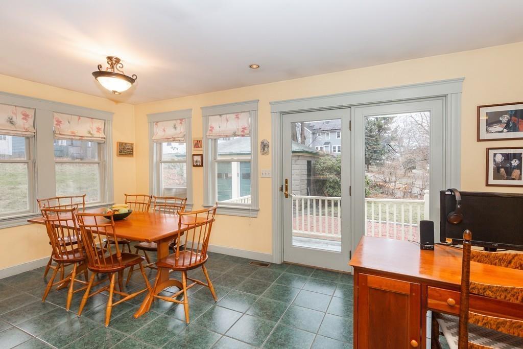 33 Robbins Road Arlington, MA 02476 - Photo 19 of 36 a view of a dining room with furniture a chandelier and wooden floor