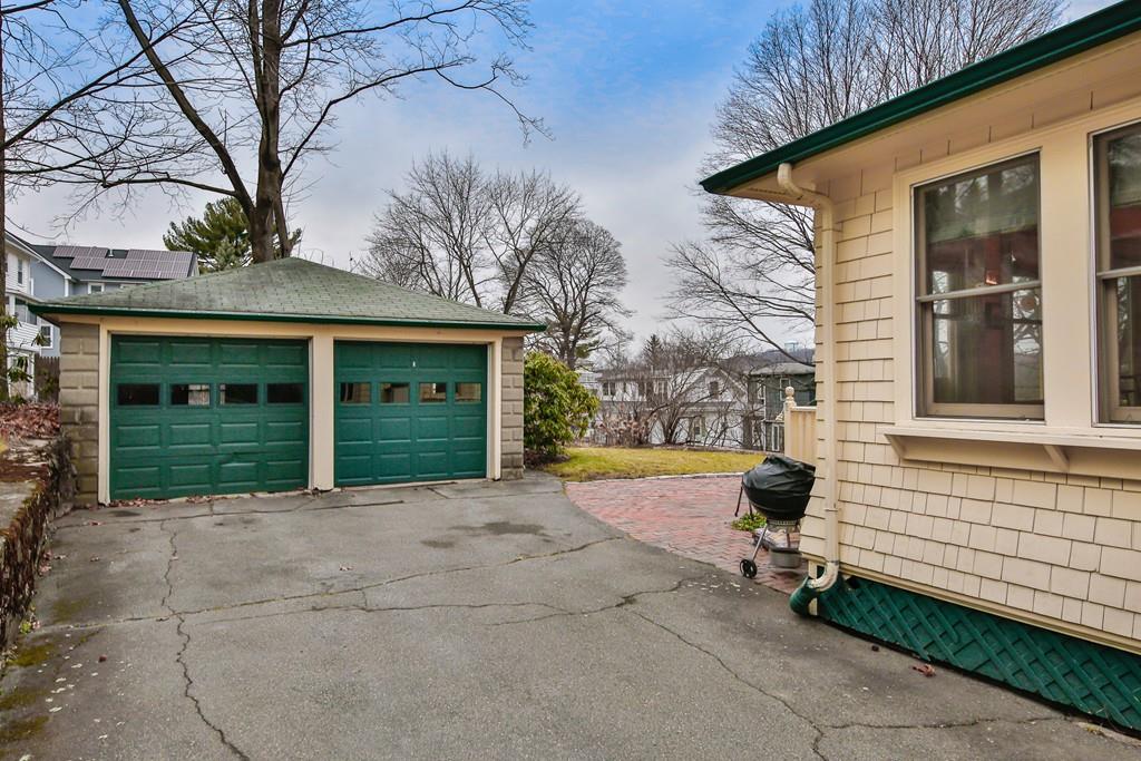 33 Robbins Road Arlington, MA 02476 - Photo 5 of 36 a front view of a house with a yard and potted plants