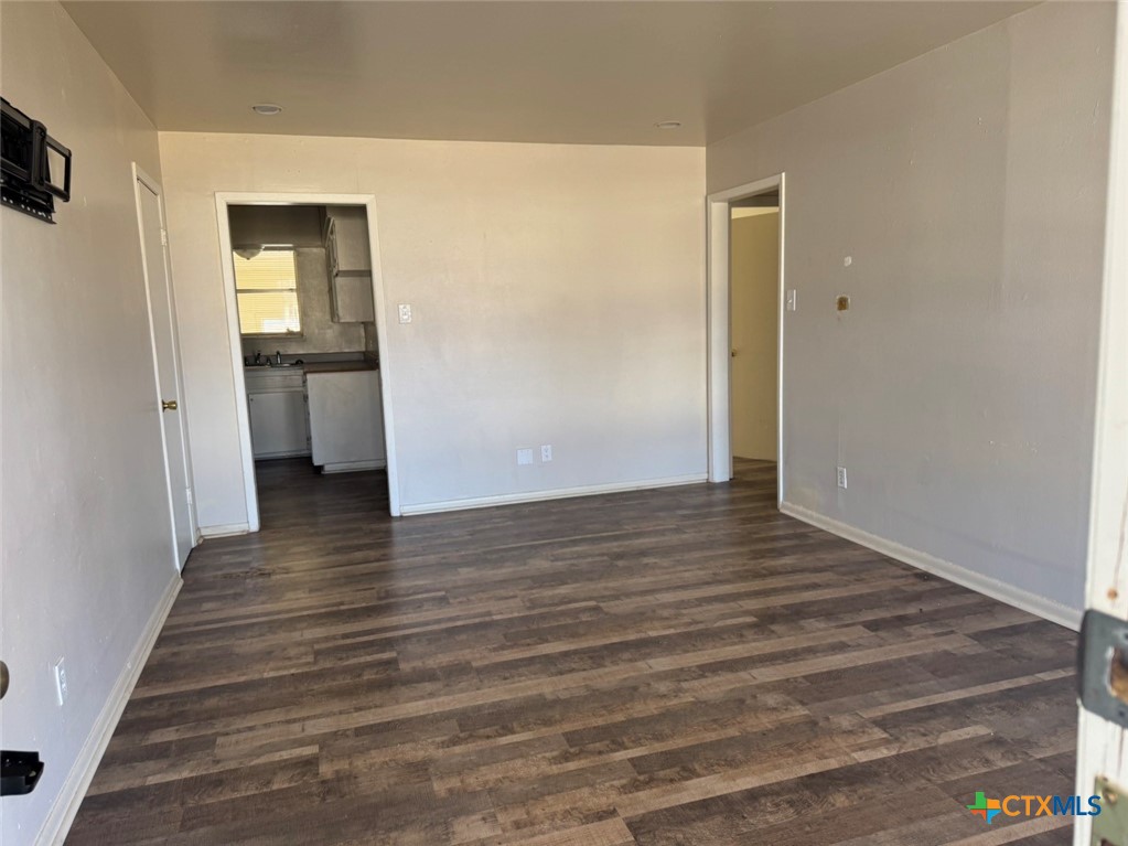 904 Houston Street Killeen, TX 76541 - Photo 10 of 17 a view of a hallway view with wooden floor and staircase