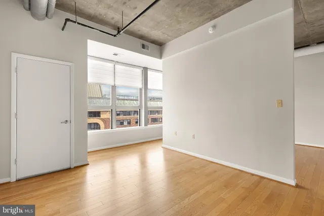 a view of an empty room with glass door