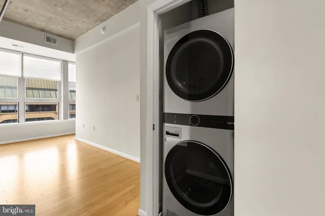 a view of a hallway with washer and dryer