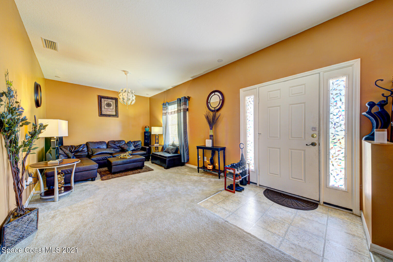1483 Wakefield Road Southeast Palm Bay, FL 32909 - Photo 12 of 42 a view of a livingroom with furniture and a window