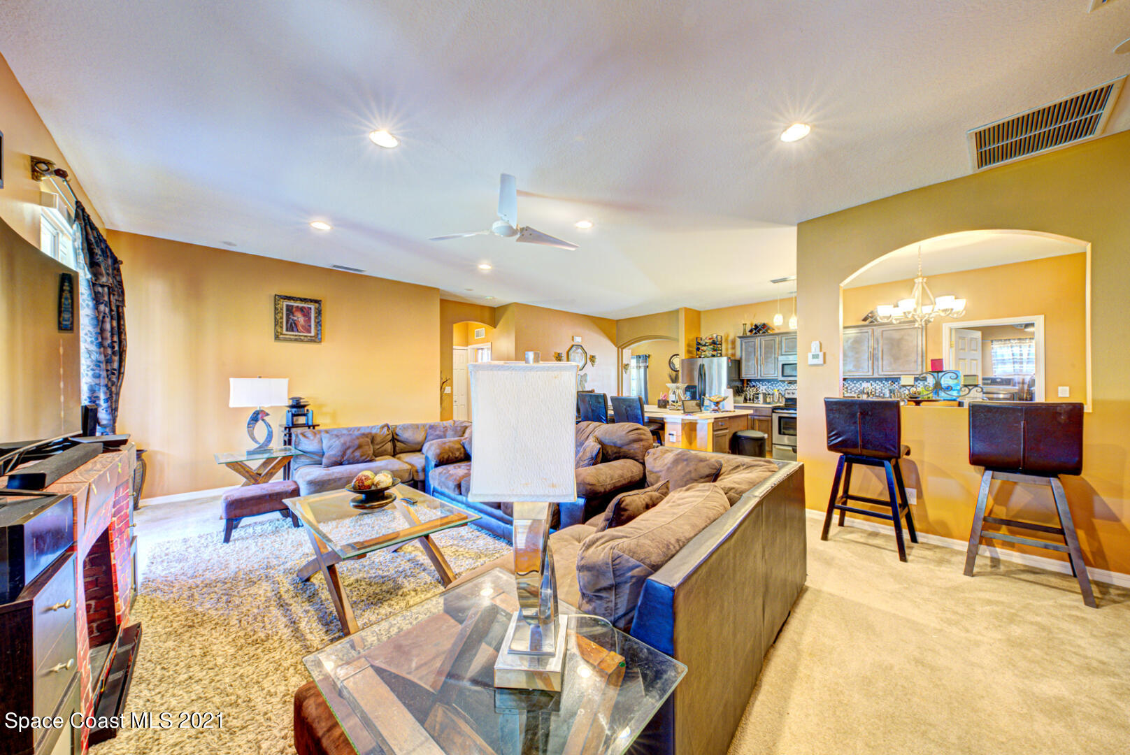 1483 Wakefield Road Southeast Palm Bay, FL 32909 - Photo 19 of 42 a living room with lots of furniture and a large window