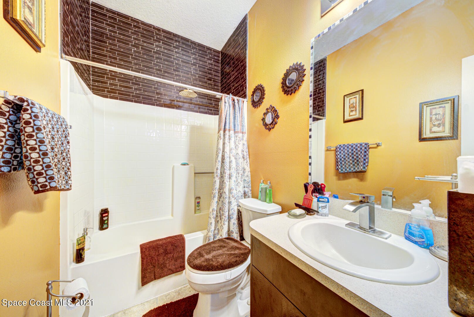 1483 Wakefield Road Southeast Palm Bay, FL 32909 - Photo 34 of 42 a bathroom with a sink and a mirror
