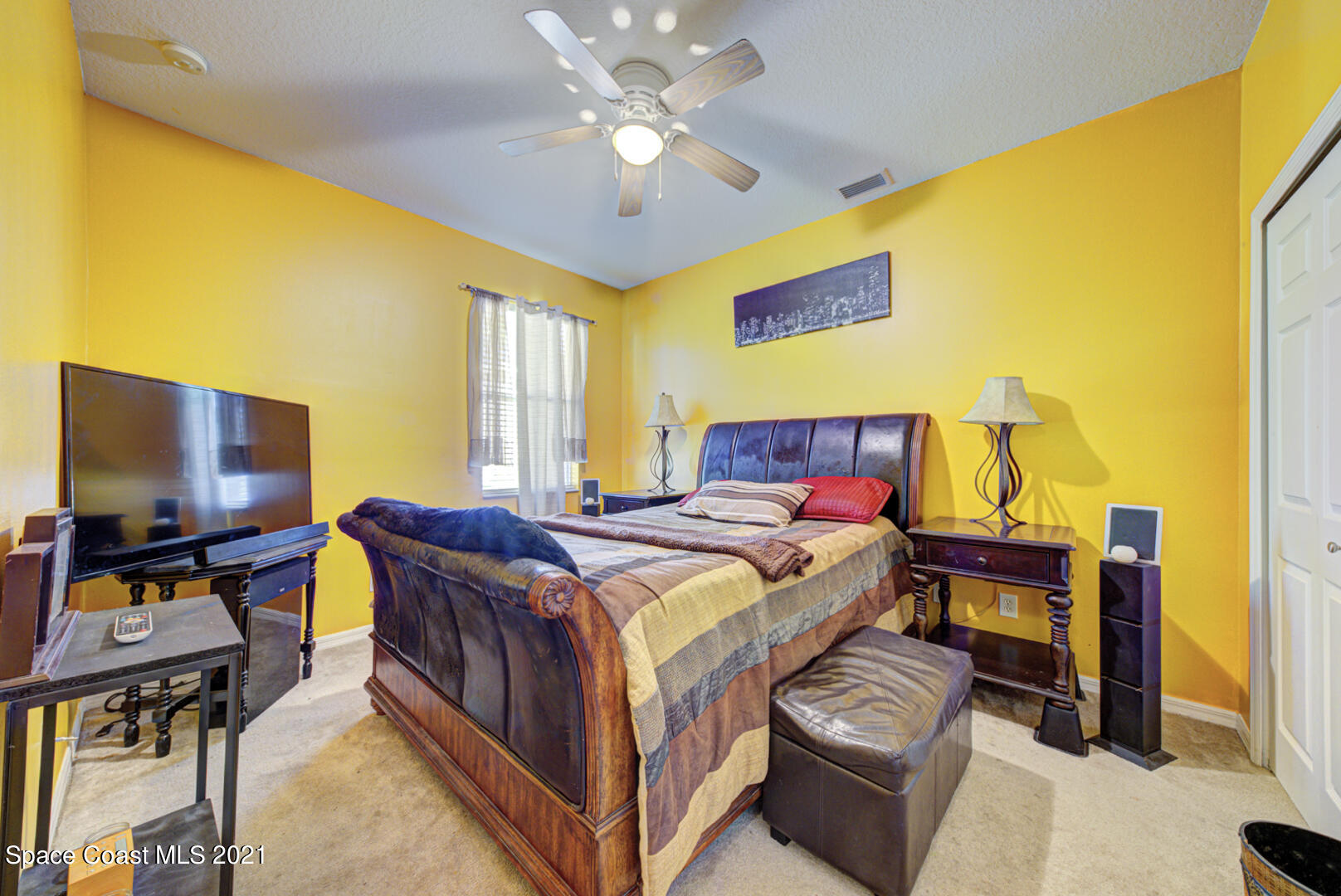 1483 Wakefield Road Southeast Palm Bay, FL 32909 - Photo 35 of 42 a bedroom with a bed and furniture