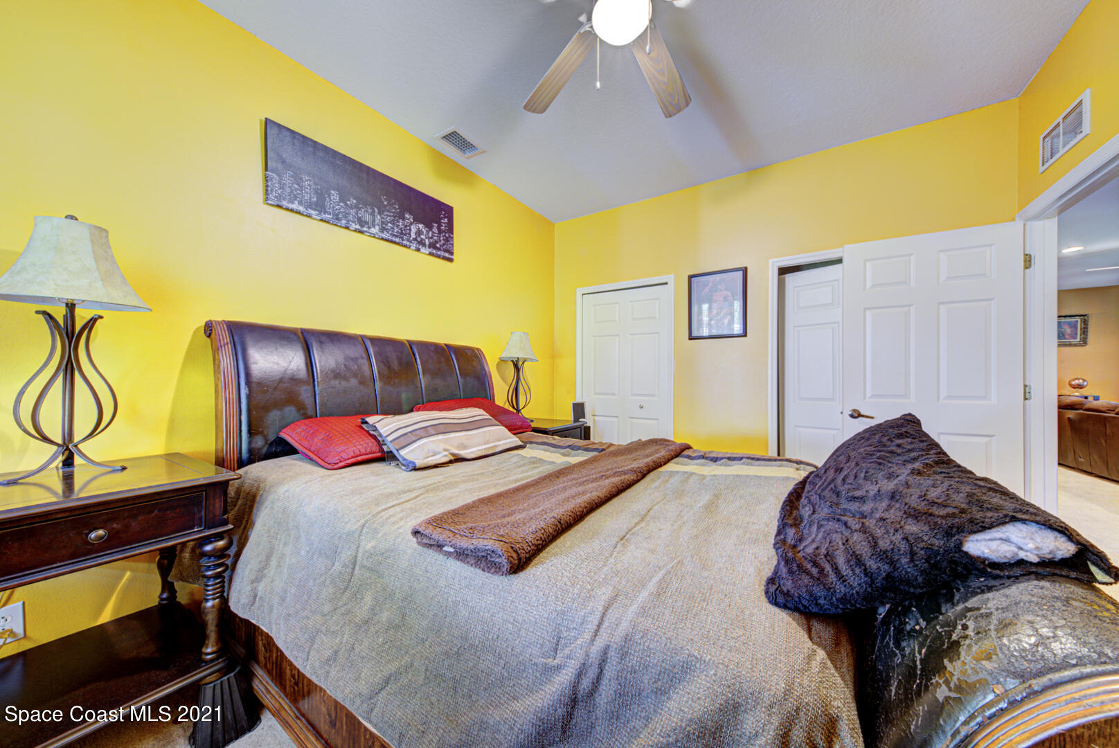 1483 Wakefield Road Southeast Palm Bay, FL 32909 - Photo 37 of 42 a bedroom with a bed and a dresser