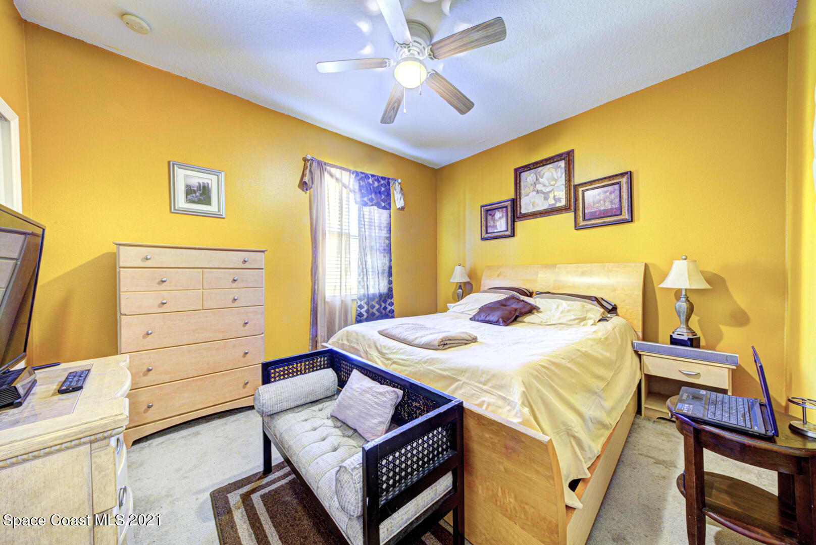 1483 Wakefield Road Southeast Palm Bay, FL 32909 - Photo 38 of 42 a bedroom with a bed and furniture