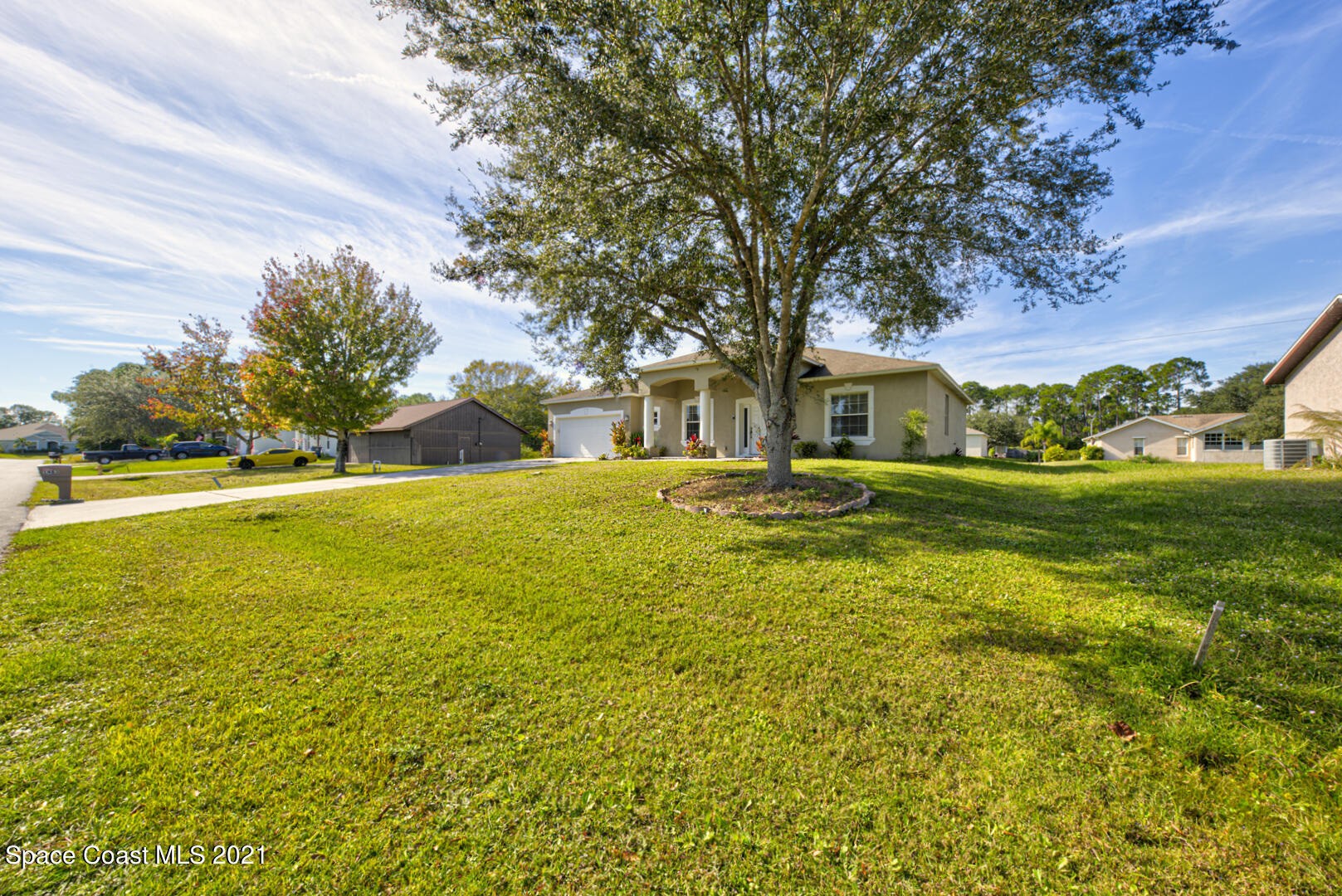 1483 Wakefield Road Southeast Palm Bay, FL 32909 - Photo 5 of 42 a house view with swimming pool in front of yard