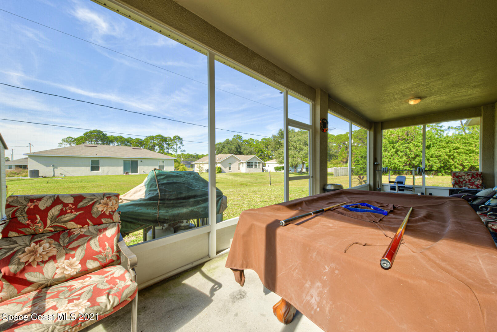 1483 Wakefield Road Southeast Palm Bay, FL 32909 - Photo 41 of 42 a bed sitting in a bedroom next to a window