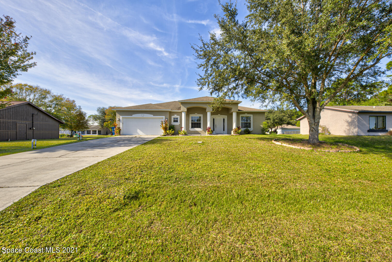 1483 Wakefield Road Southeast Palm Bay, FL 32909 - Photo 6 of 42 a view of a house with a swimming pool