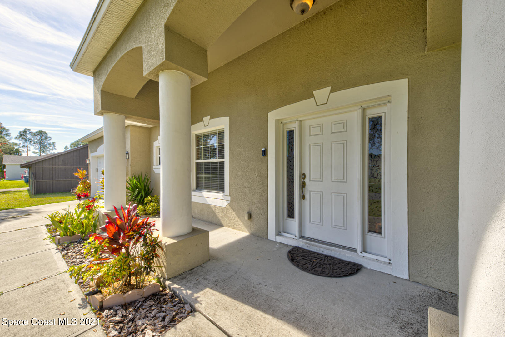 1483 Wakefield Road Southeast Palm Bay, FL 32909 - Photo 7 of 42 a view of a entryway door front of house