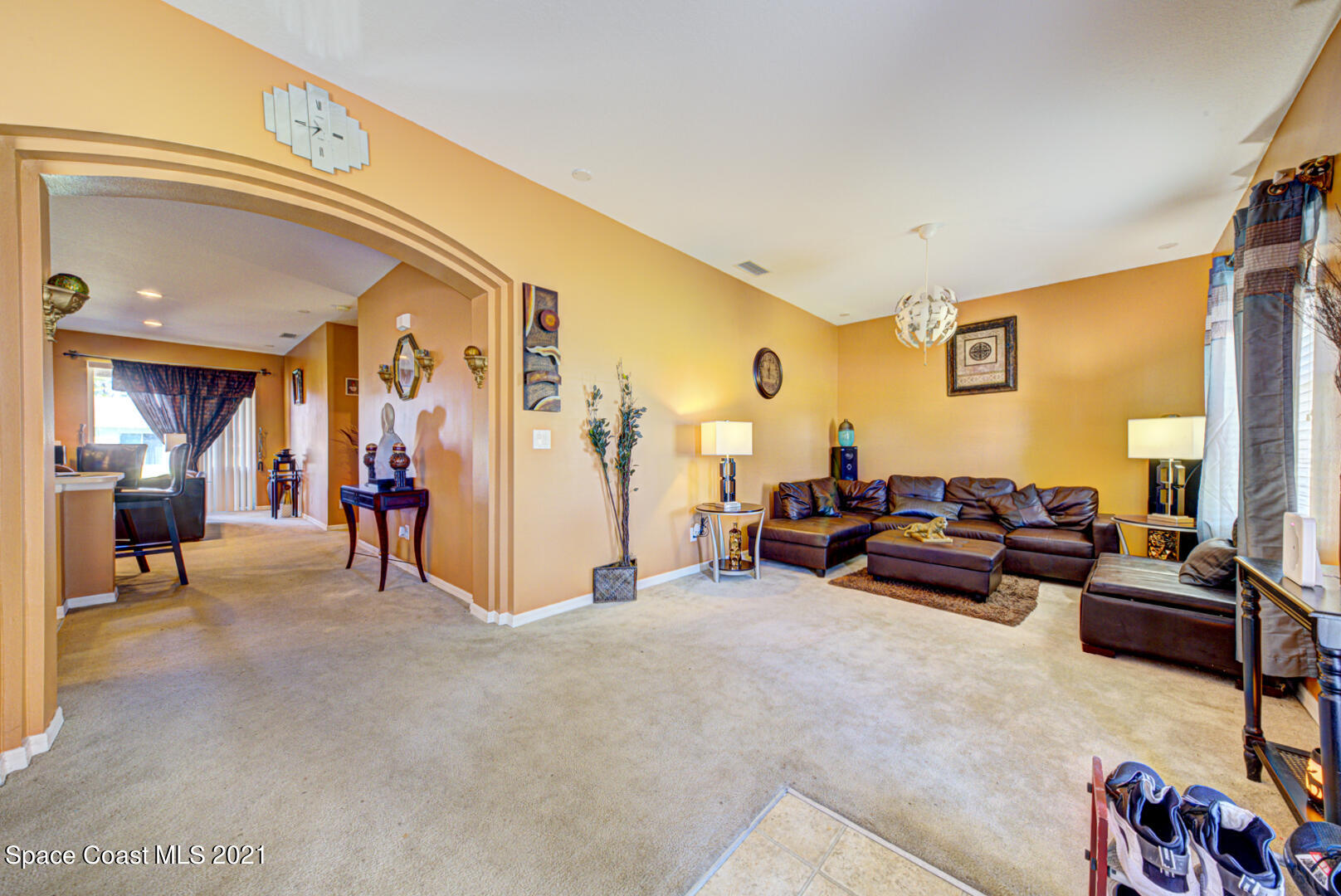 1483 Wakefield Road Southeast Palm Bay, FL 32909 - Photo 8 of 42 a living room with furniture and a gym machine