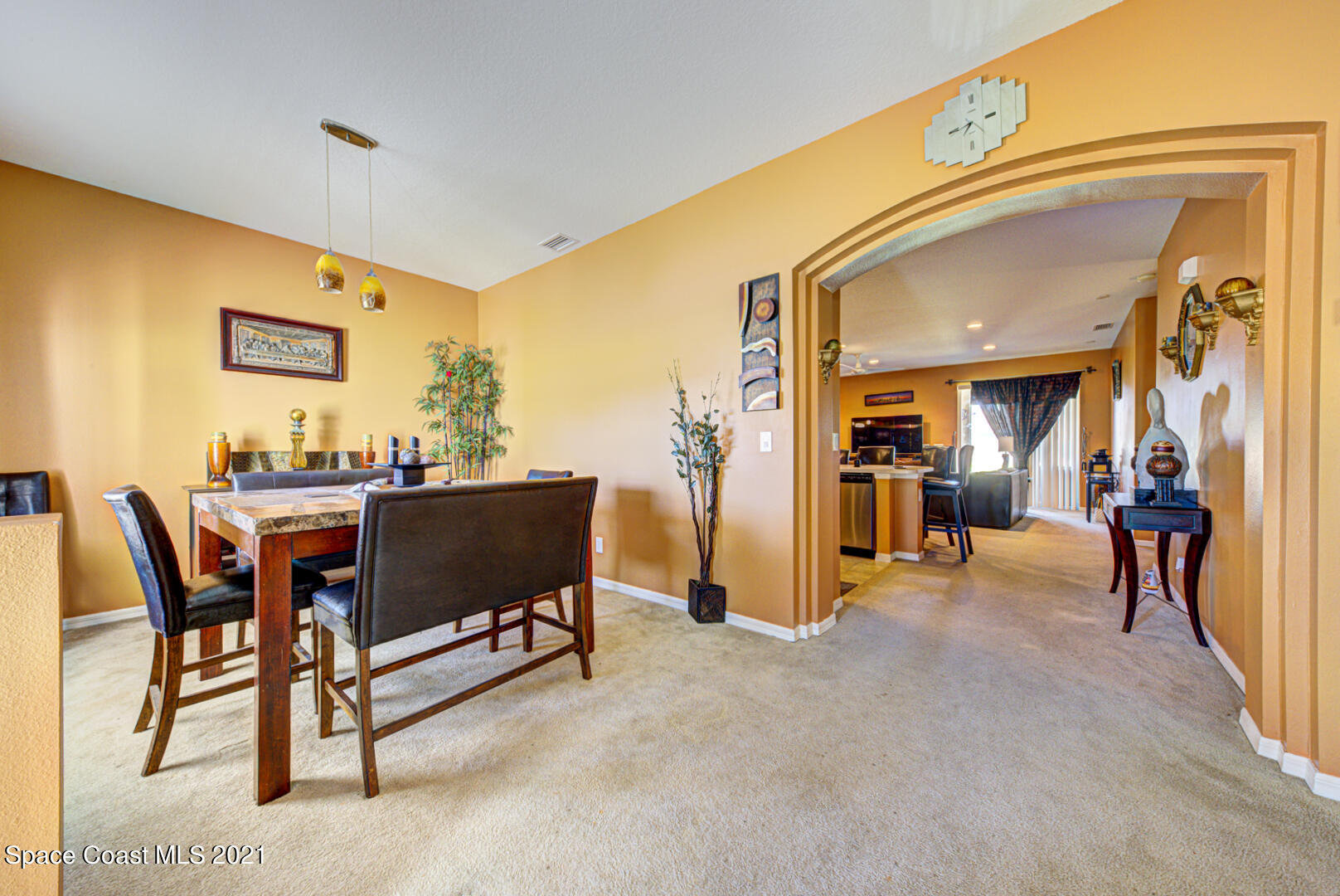 1483 Wakefield Road Southeast Palm Bay, FL 32909 - Photo 9 of 42 a dining room with furniture and a chandelier