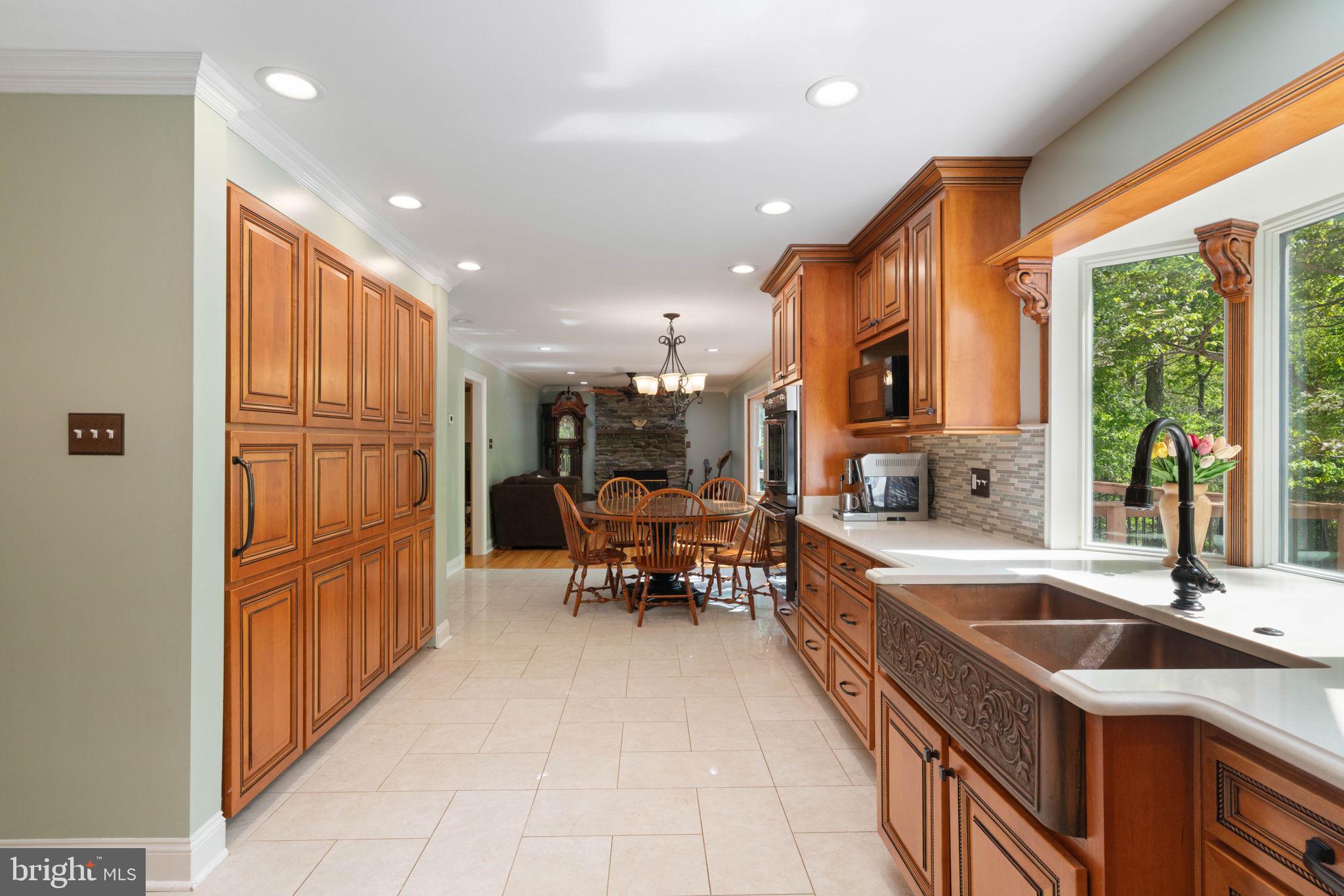 12522 Spring Drive Manassas, VA 20112 - Photo 24 of 69 Warm wood tones in a spacious kitchen.