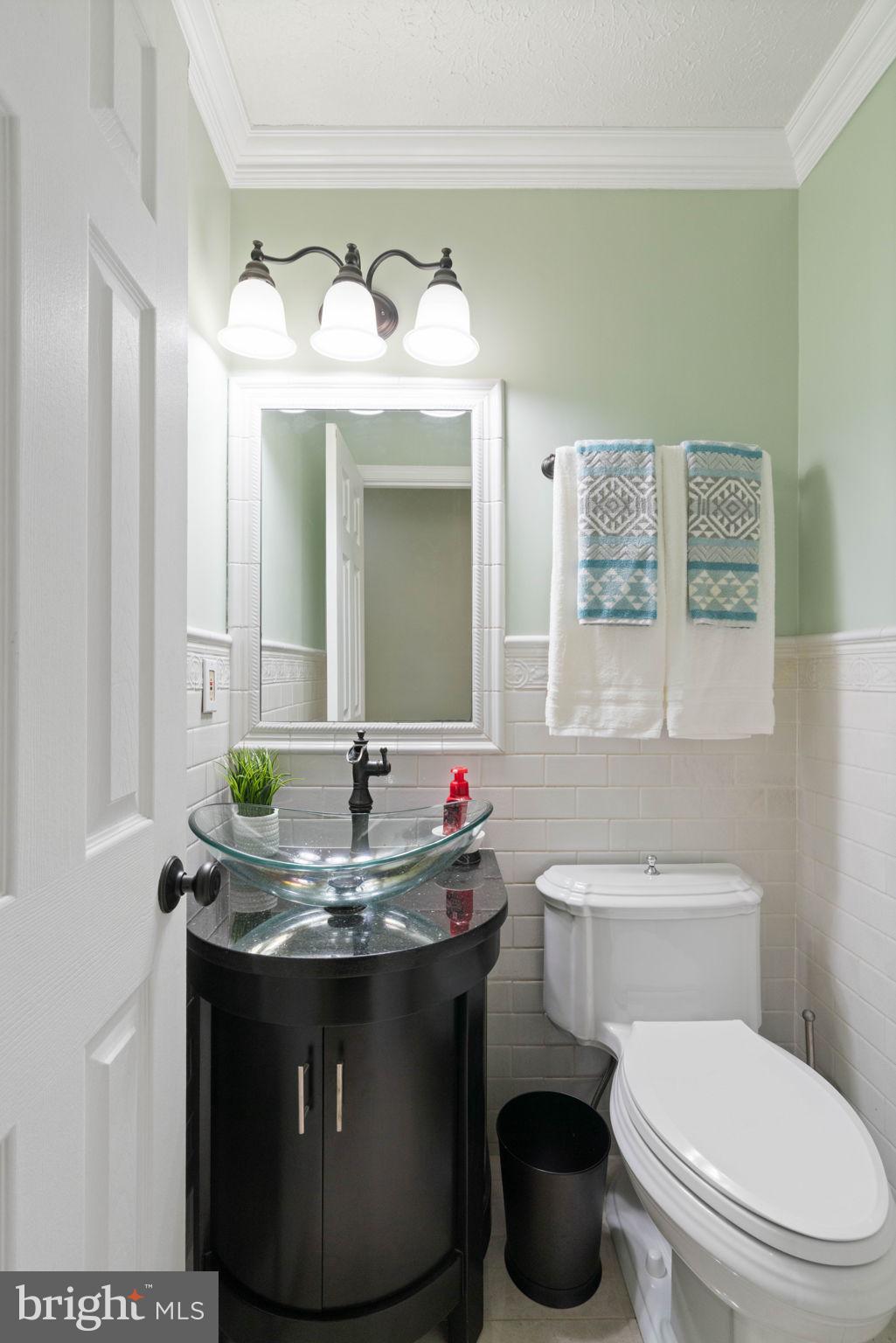 12522 Spring Drive Manassas, VA 20112 - Photo 26 of 69 Chic powder room with modern elegance.