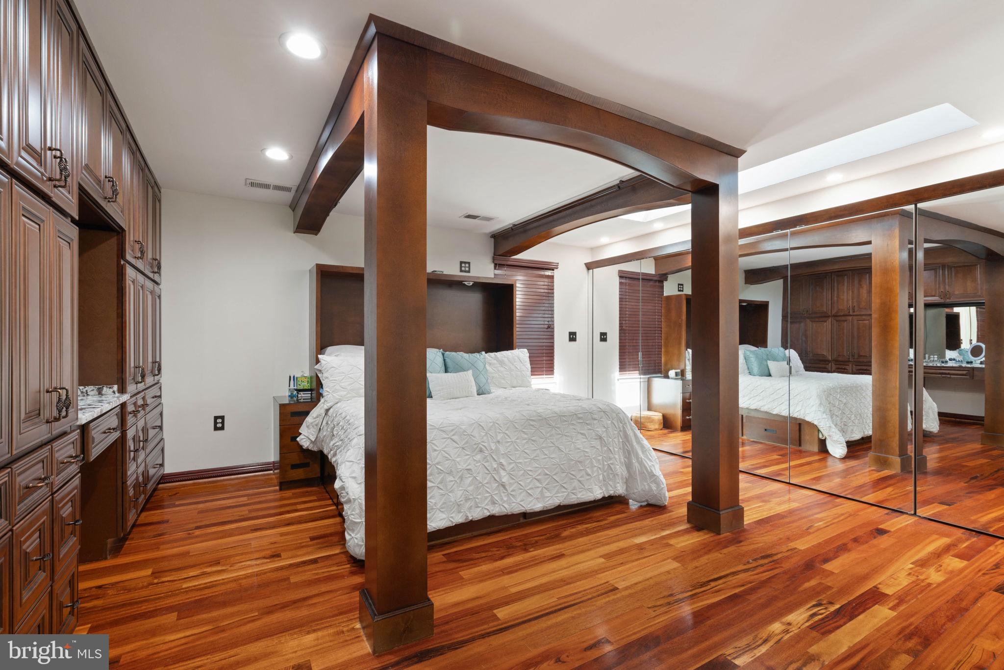 12522 Spring Drive Manassas, VA 20112 - Photo 27 of 69 Elegant bedroom with rich wood accents.