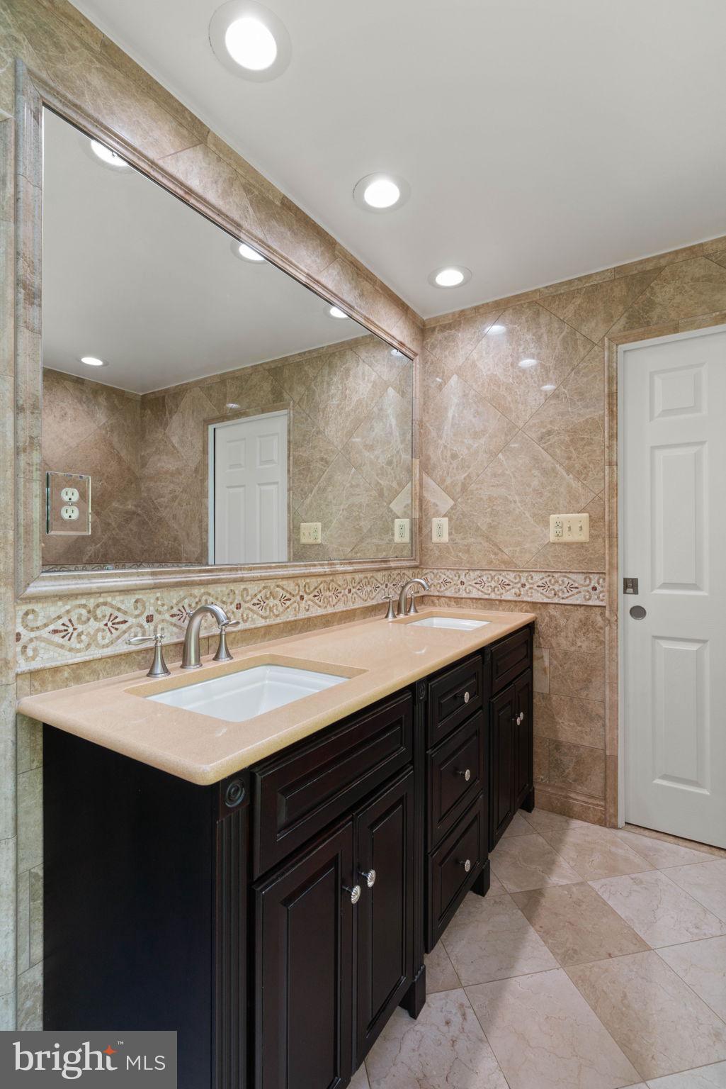 12522 Spring Drive Manassas, VA 20112 - Photo 31 of 69 Elegant dual-sink bathroom retreat.