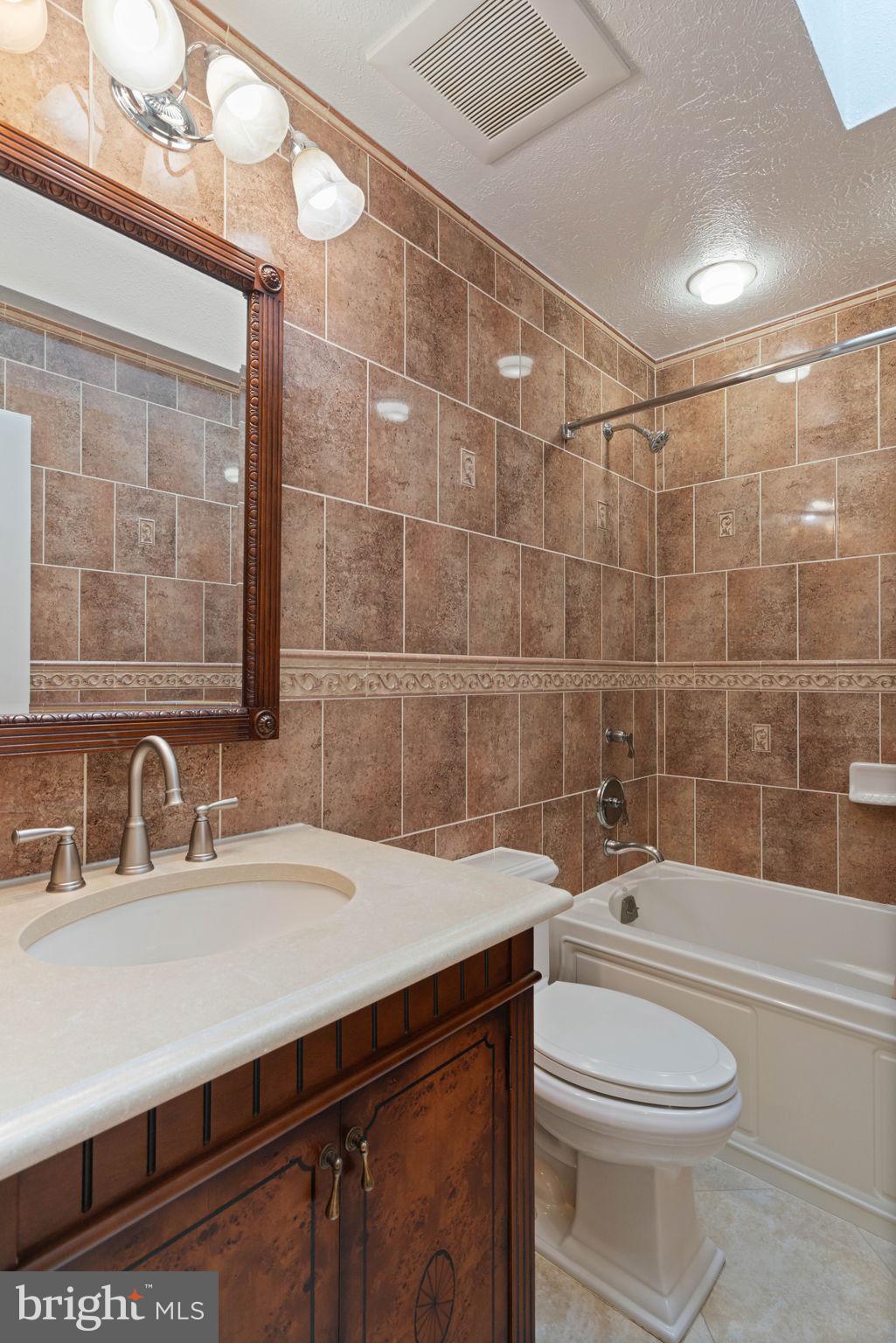 12522 Spring Drive Manassas, VA 20112 - Photo 41 of 69 Elegant bathroom with rich tile accents.