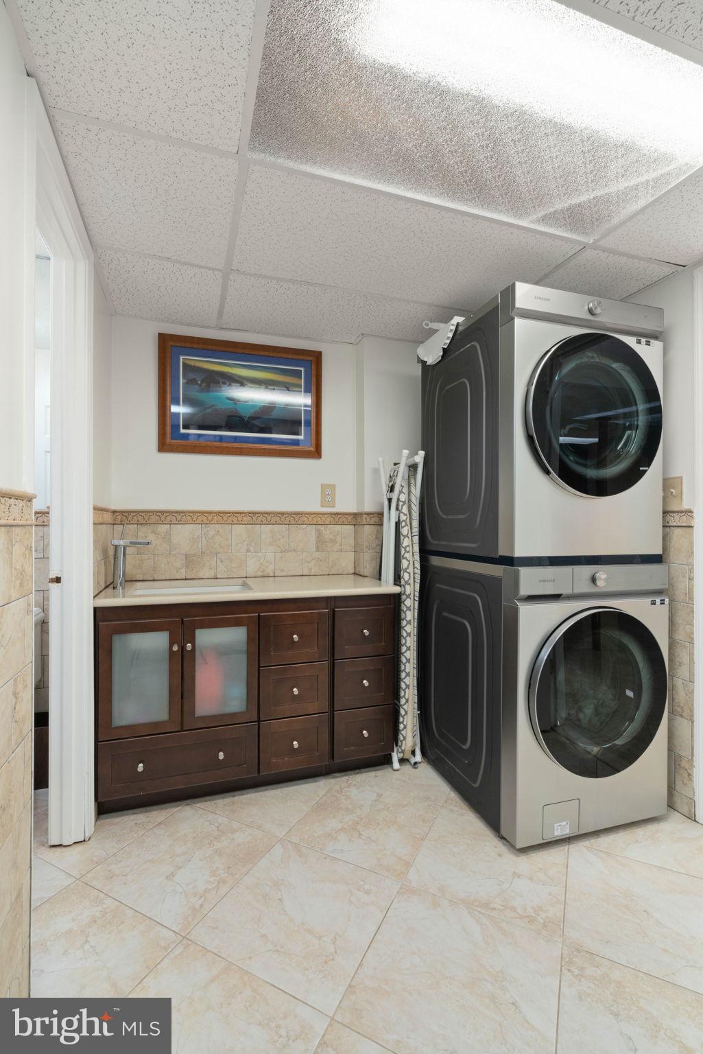 12522 Spring Drive Manassas, VA 20112 - Photo 50 of 69 Modern laundry space with sleek appliances.