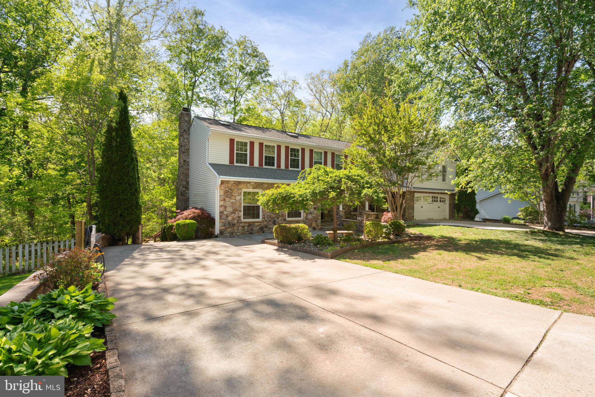 12522 Spring Drive Manassas, VA 20112 - Photo 6 of 69 Charming home nestled in lush greenery.