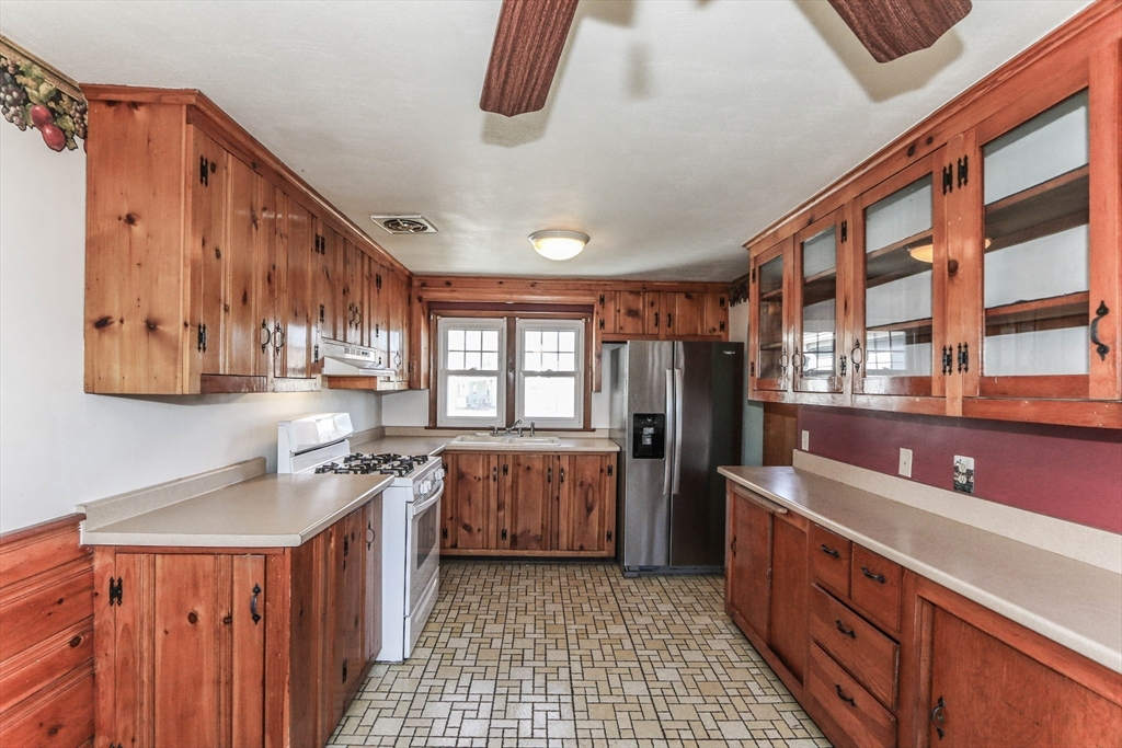 185 East Street Springfield, MA 01104 - Photo 11 of 26 a kitchen with stainless steel appliances granite countertop a stove a sink dishwasher and a refrigerator