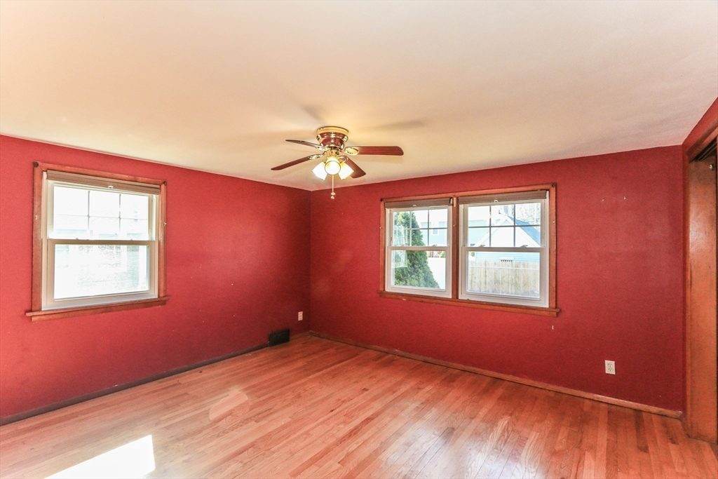 185 East Street Springfield, MA 01104 - Photo 15 of 26 a view of an empty room with a window and wooden floor