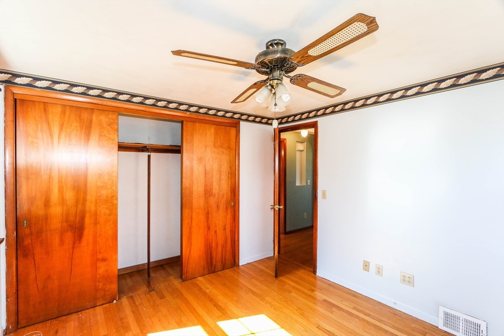 185 East Street Springfield, MA 01104 - Photo 17 of 26 a view of a room with closet and wooden floor