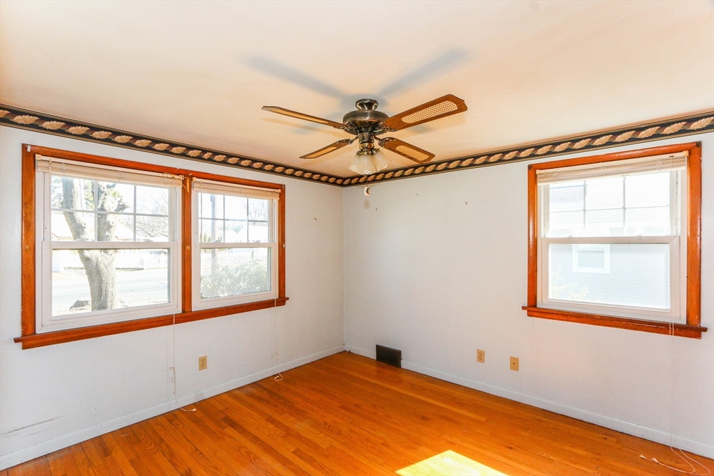 185 East Street Springfield, MA 01104 - Photo 18 of 26 an empty room with windows and fan