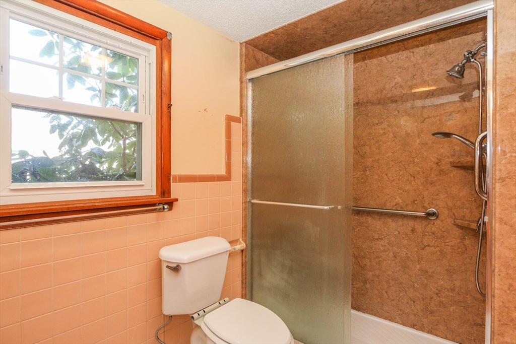 185 East Street Springfield, MA 01104 - Photo 20 of 26 a bathroom with a toilet and a shower