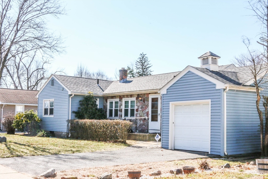 185 East Street Springfield, MA 01104 - Photo 2 of 26 a view of a house with a yard covered in snow