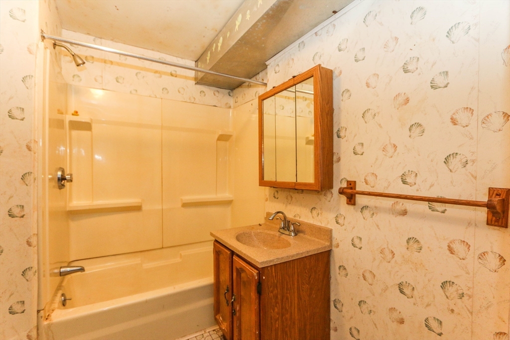 185 East Street Springfield, MA 01104 - Photo 23 of 26 a bathroom with a sink and a shower