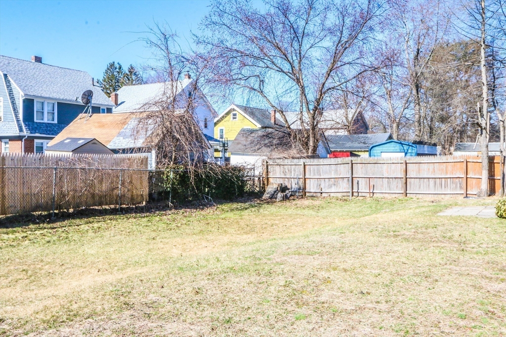 185 East Street Springfield, MA 01104 - Photo 4 of 26 a view of a house with a yard