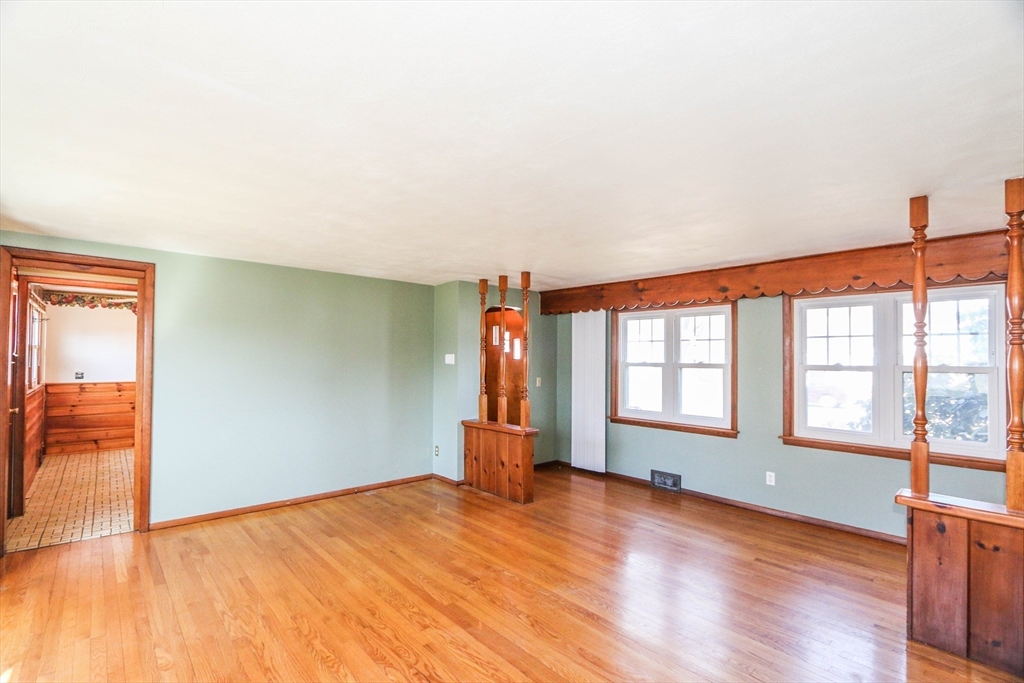 185 East Street Springfield, MA 01104 - Photo 9 of 26 an empty room with wooden floor and windows