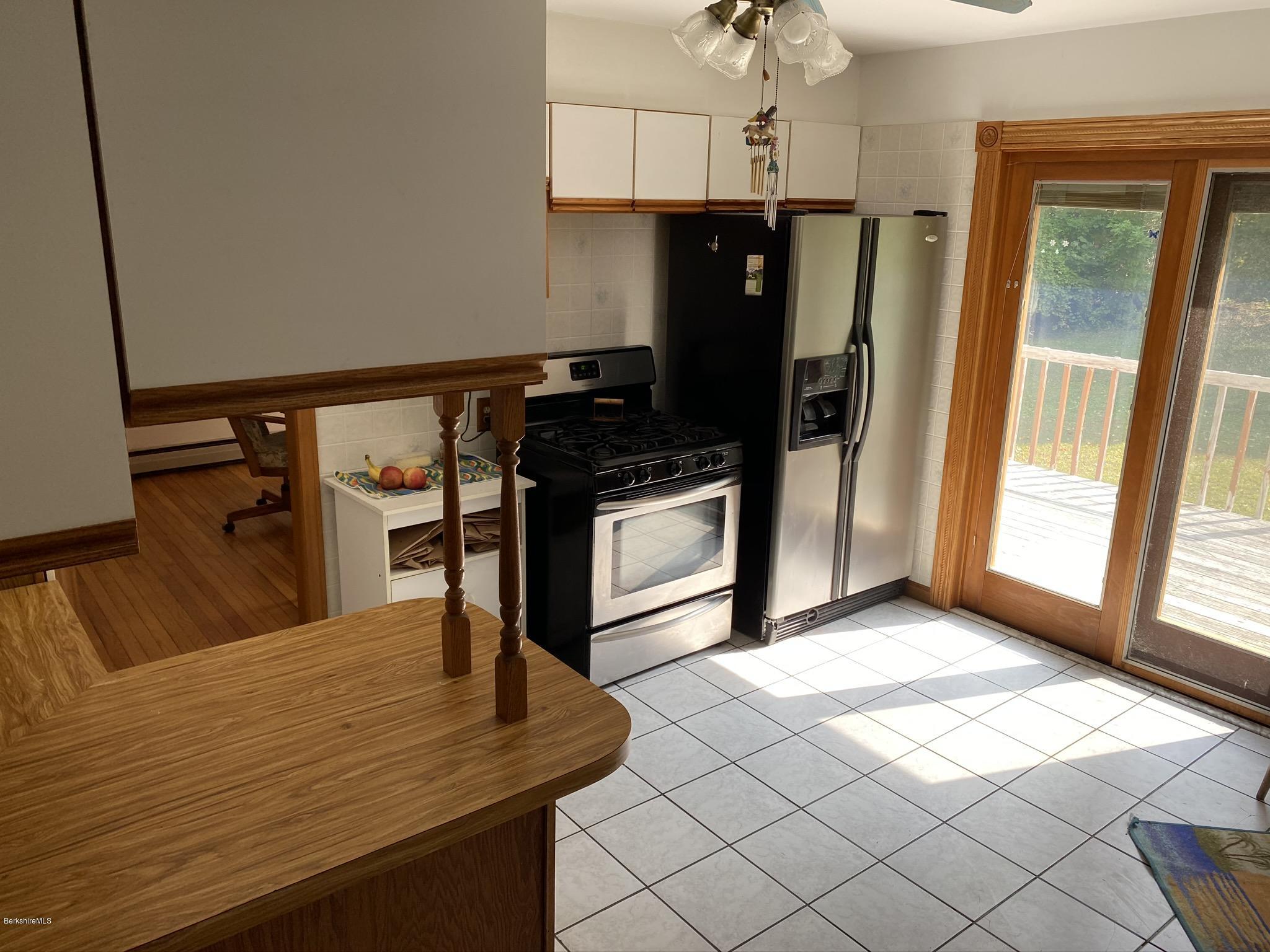 311 Swamp Road Richmond, MA 01201 - Photo 21 of 42 a kitchen with stainless steel appliances granite countertop a refrigerator and a stove