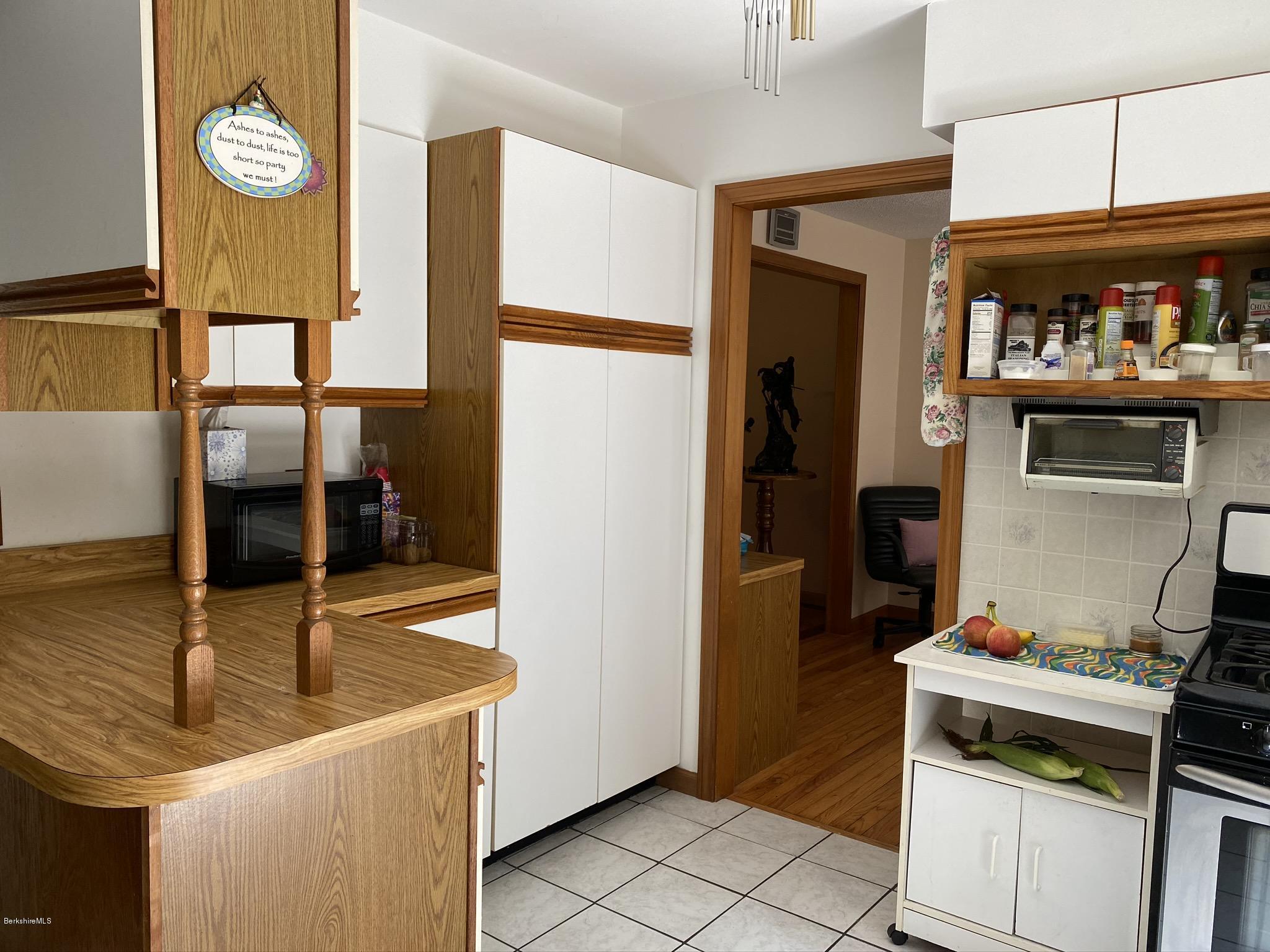 311 Swamp Road Richmond, MA 01201 - Photo 24 of 42 a kitchen with a sink and a stove top oven