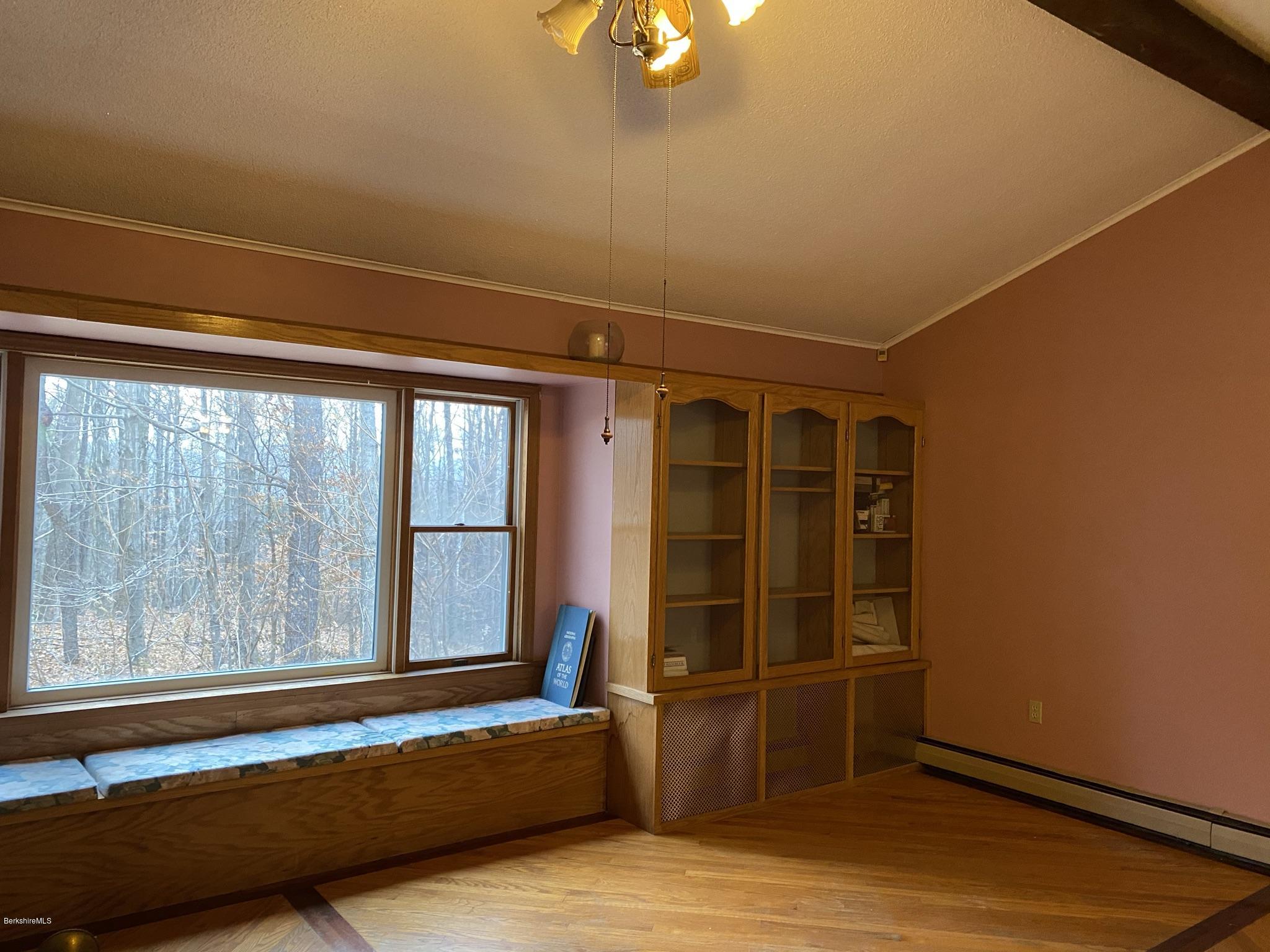 311 Swamp Road Richmond, MA 01201 - Photo 27 of 42 a view of a room with wooden floor and windows