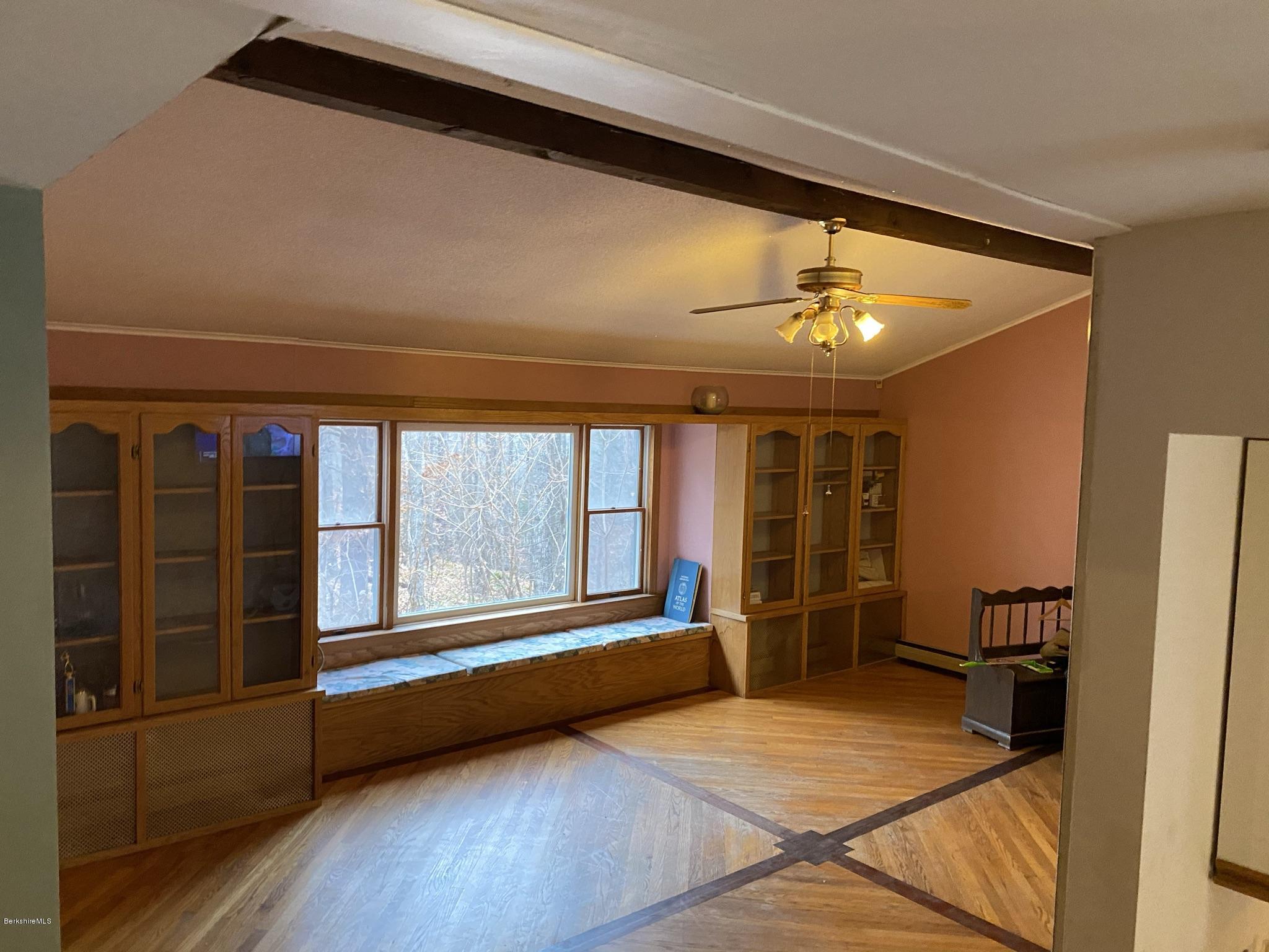 311 Swamp Road Richmond, MA 01201 - Photo 29 of 42 wooden floor in an empty room with a window