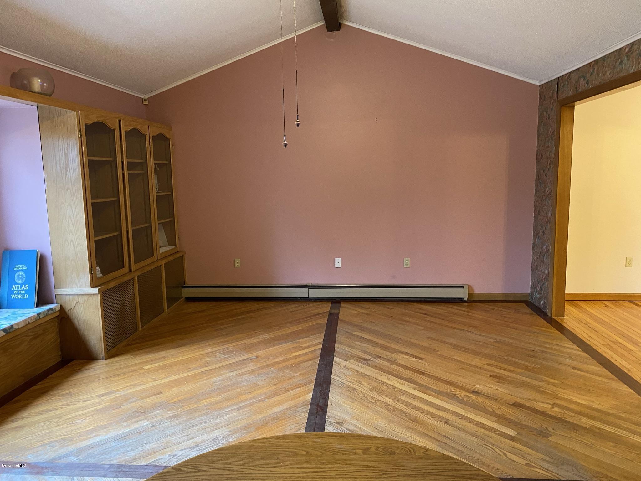 311 Swamp Road Richmond, MA 01201 - Photo 30 of 42 a view of an empty room with wooden floor and a window