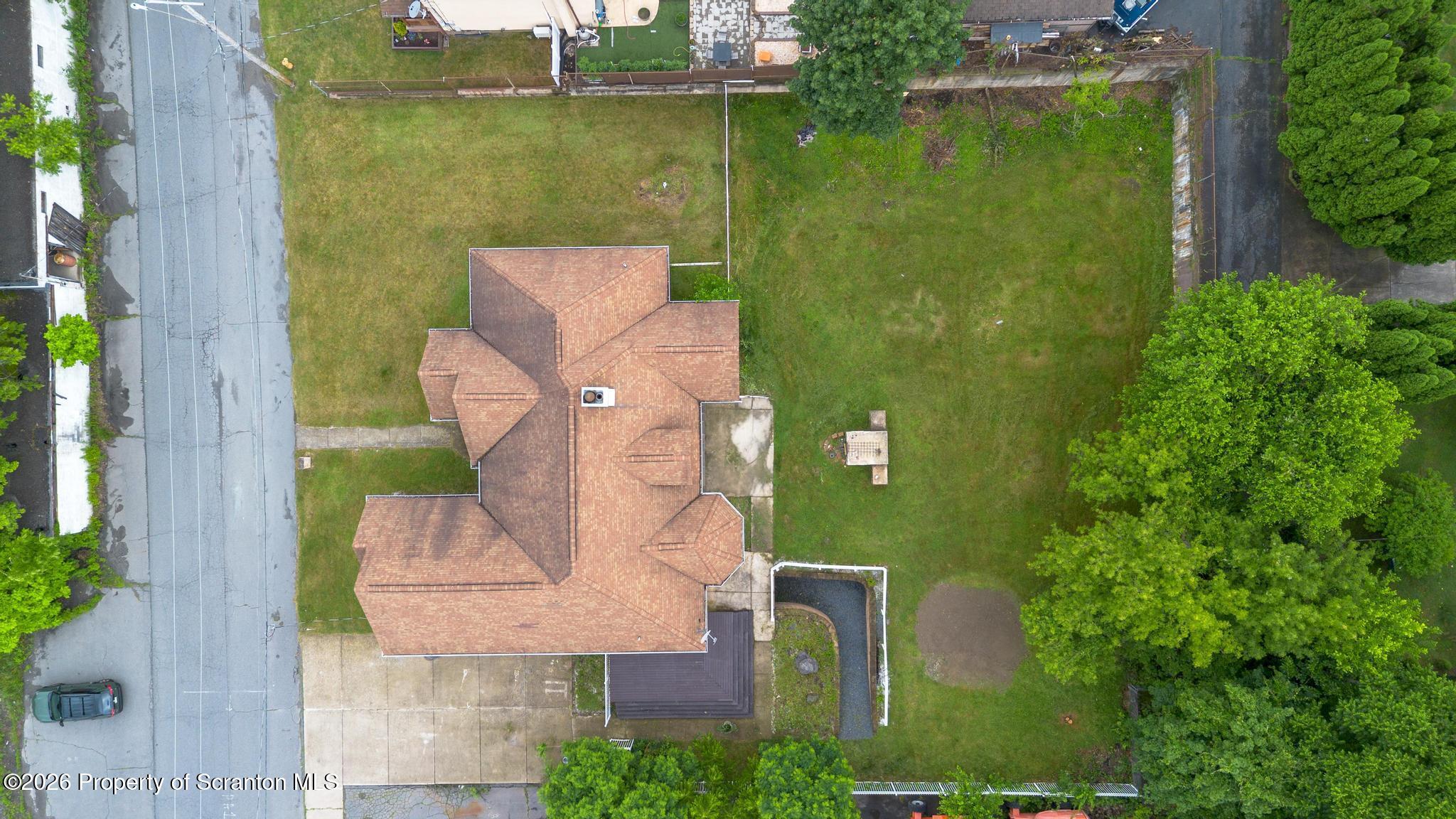 116 Forge Street Old Forge, PA 18518 - Photo 47 of 49 an aerial view of a house with a garden and lake view