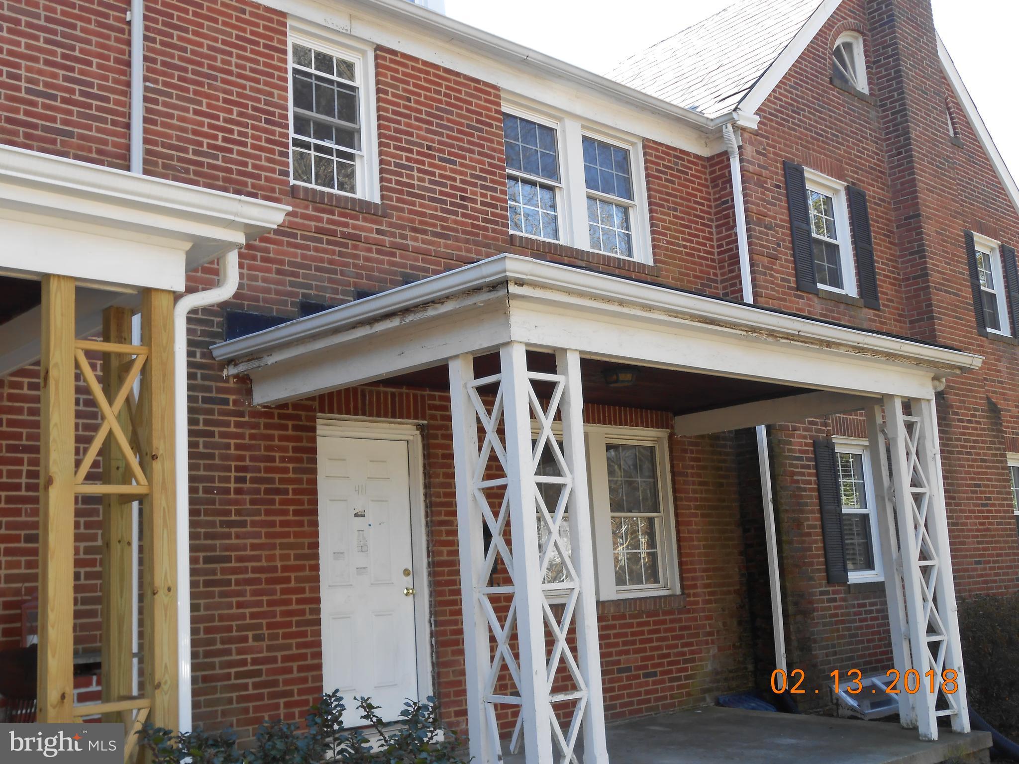 411 Dumbarton Road Baltimore, MD 21212 - Photo 1 of 25 a front view of a house