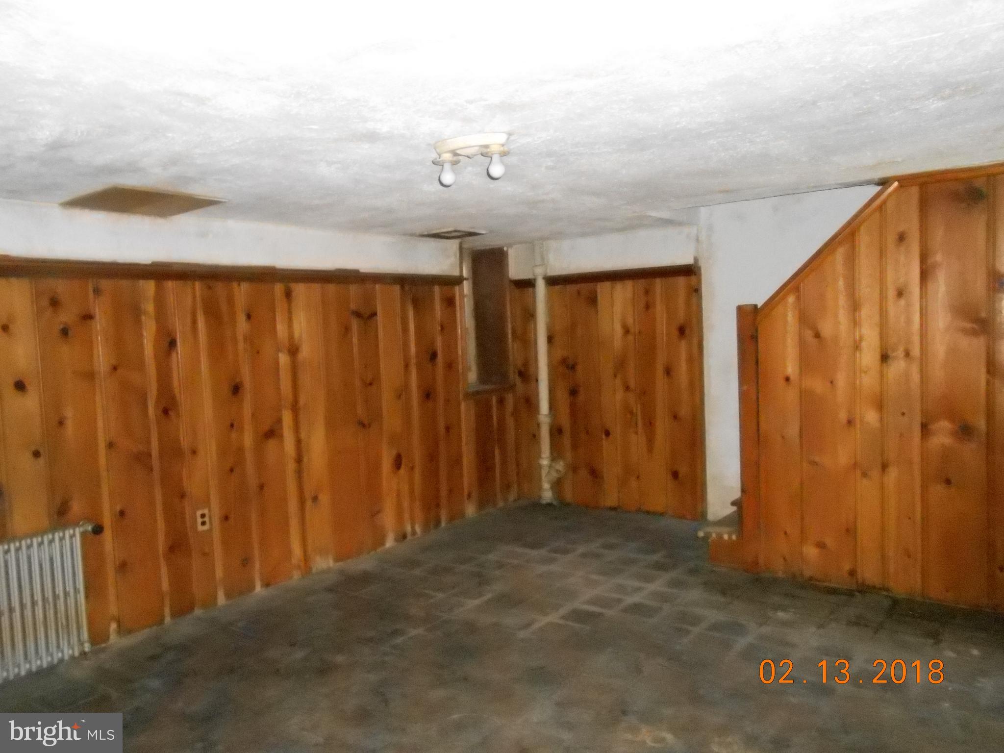 411 Dumbarton Road Baltimore, MD 21212 - Photo 11 of 25 a view of a room with a wooden floor and curtain