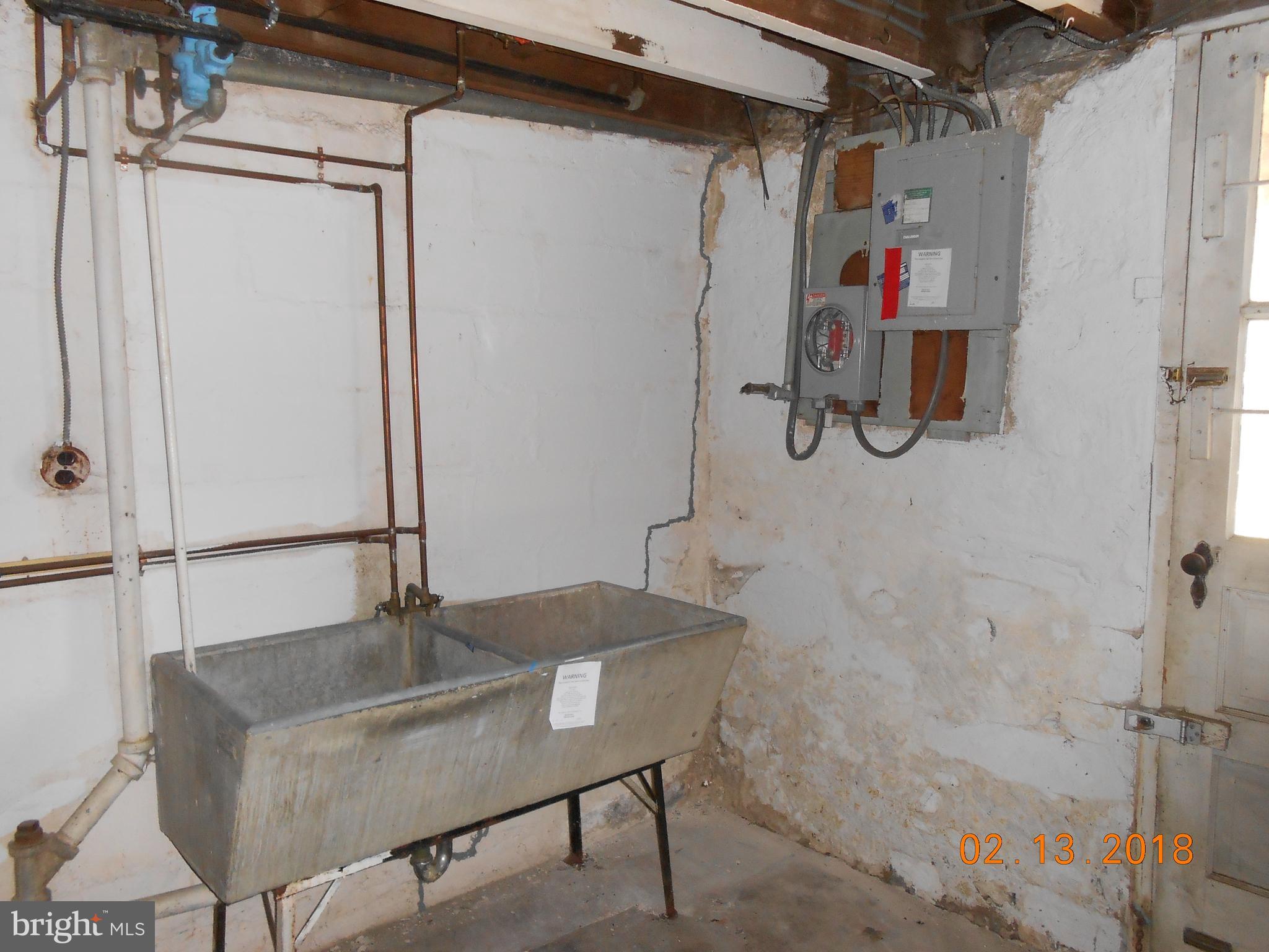 411 Dumbarton Road Baltimore, MD 21212 - Photo 13 of 25 a bathroom with a sink and a shower