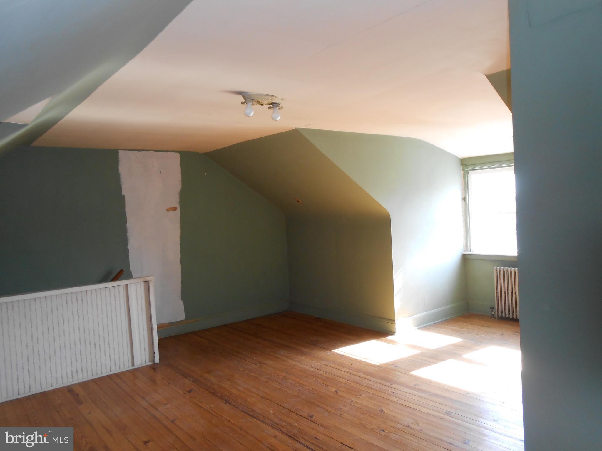 411 Dumbarton Road Baltimore, MD 21212 - Photo 23 of 25 a view of empty room with wooden floor