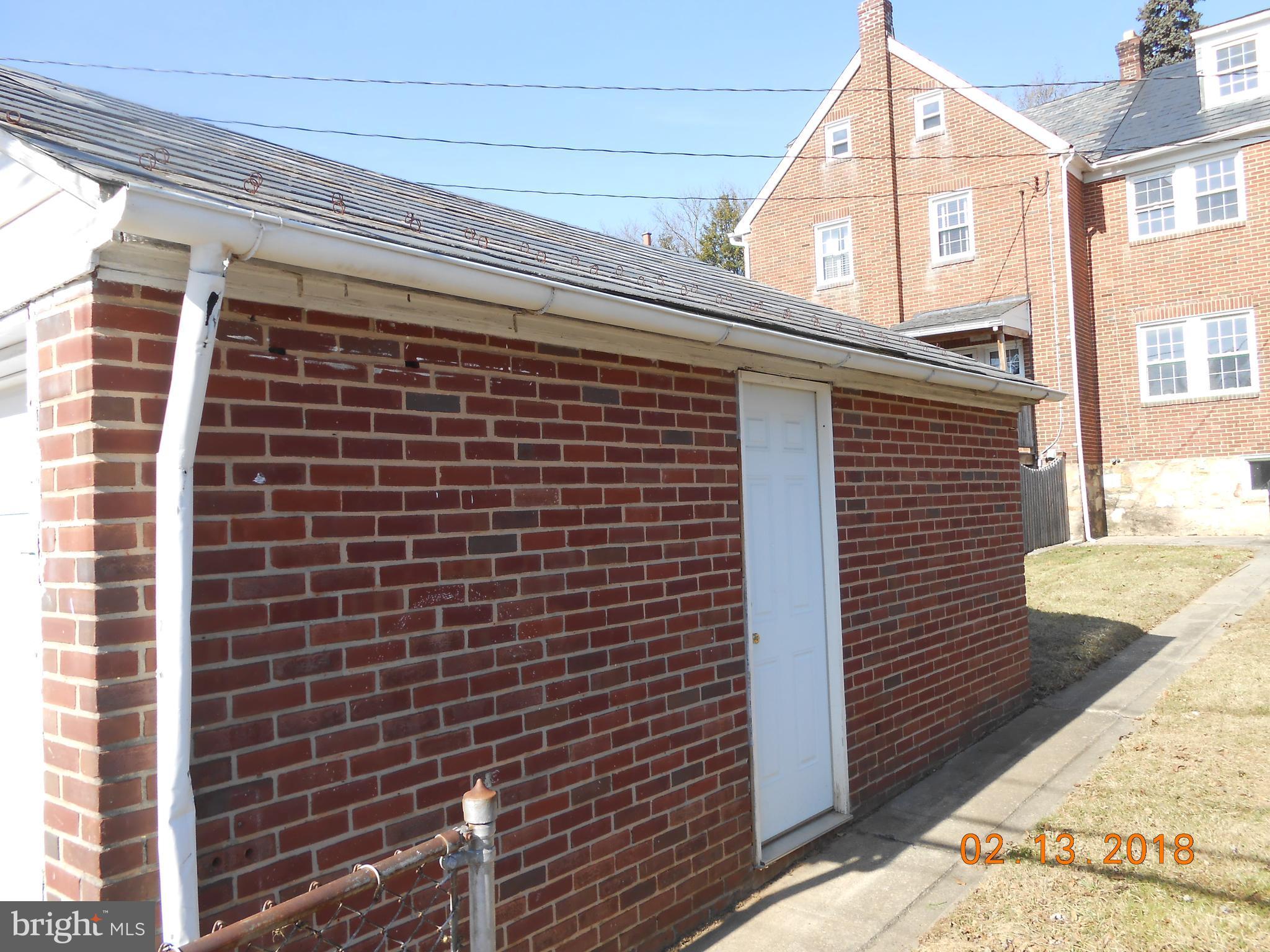 411 Dumbarton Road Baltimore, MD 21212 - Photo 8 of 25 a view of a brick wall