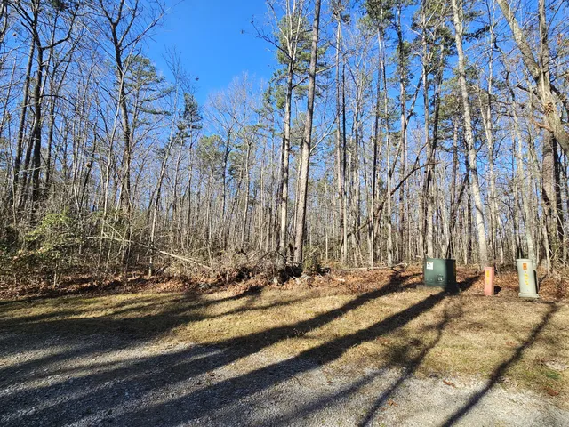 a sign board with yard in front of it